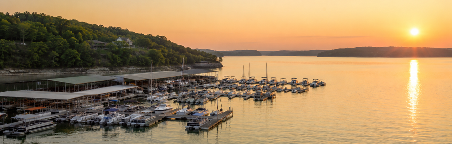 Marina at sunset on a wooded lake